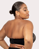 Back of black strapless push-up bra with hook-and-eye closure