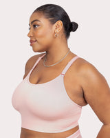 Seamless wireless longline bra in blushing rose, side view with smooth ribbed fabric