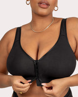 Black wireless bra with front hook-and-eye closure, V-scoop neckline and wide straps